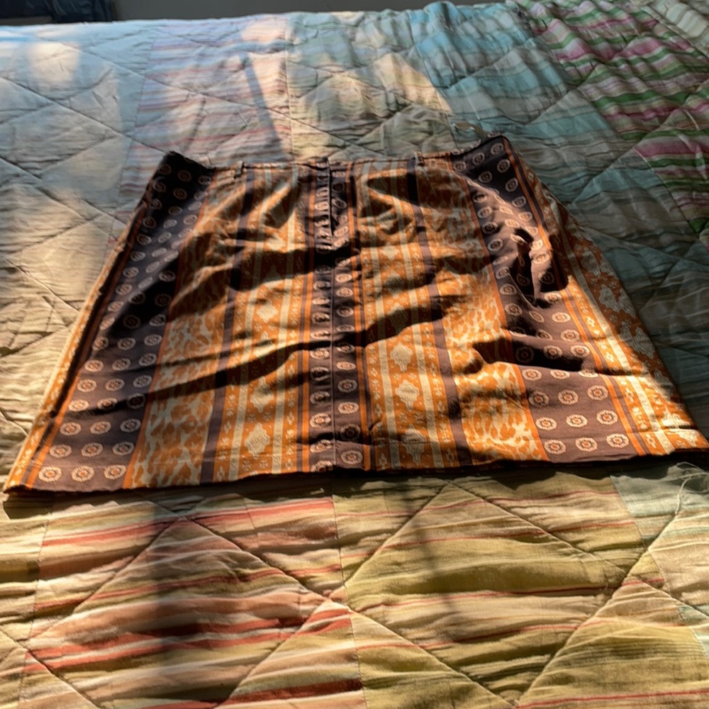 Brown and tan, rust, skirt.